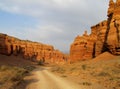 Road in red Canyon Charyn (Sharyn) at sunset Royalty Free Stock Photo